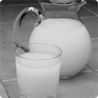 Glass and Pitcher With Liquid Contents: